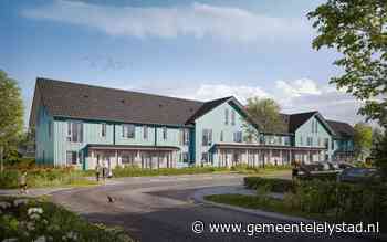 Verlichte kerstboom markeert start bouw huurwoningen