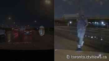 Video shows man pointing gun at vehicles on Highway 401