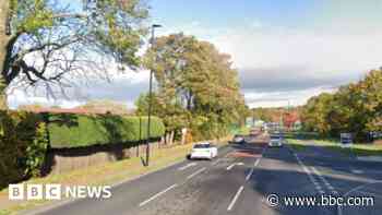 Man, 80, hit by motorbike while crossing road