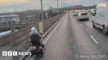 Truck shields mobility scooter driver on motorway