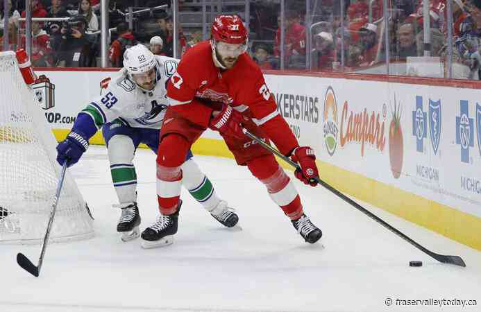 Jake DeBrusk scores hat trick, including OT game-winner, as Canucks top Red Wings 5-4