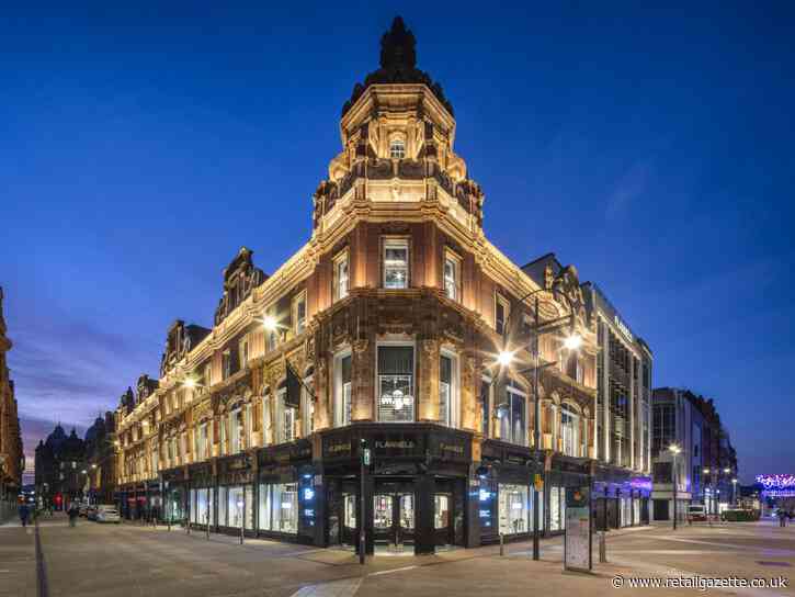 Frasers lowers profit outlook as sales slide