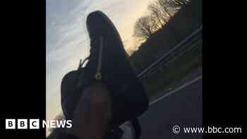 Killer driver sped with feet out of car window