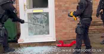 Police officers smash through door in Bristol during drug bust