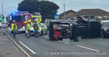 Flipped car blocks road in Bournemouth