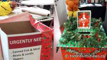 Striking Canada Post workers continue annual Santa letter tradition, while also helping Toronto food bank