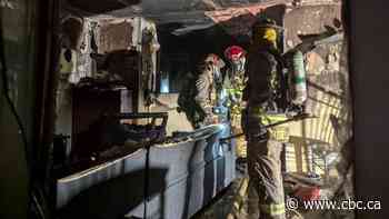 Ottawa mother 'walked through fire' to save son from burning house, family member says