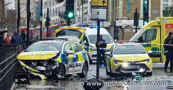 Crash involving police car shuts major Hackney road - as it happened