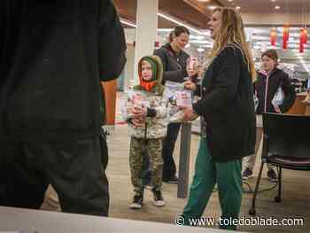 Gift bags handed out to homeless at main library