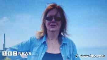 Urgent search for woman stuck in estuary mud