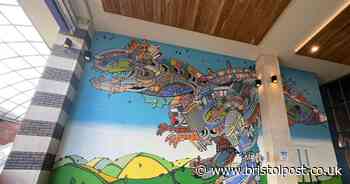 Bristol dinosaur artist unveils huge Cabot Circus mural to mark 20 years of groundbreaking work