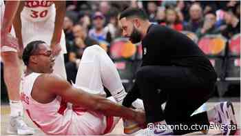 Scottie Barnes wearing air cast boot to protect sprained right ankle