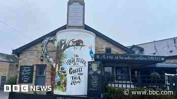 Giant mug back in place after Storm Darragh damage