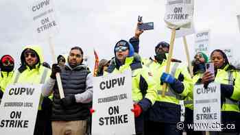 Postal workers on Toronto picket line react as Ottawa moves to end strike