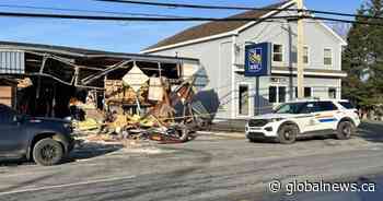 Backhoe used to tear the front off Newfoundland bank, four facing charges: RCMP