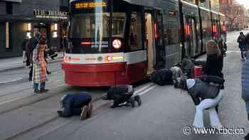 #TheMoment Toronto commuters saved a cat stuck under a streetcar