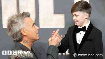 Boy meets Robbie Williams after starring in biopic