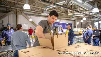 Corporate volunteers help food bank meet demand