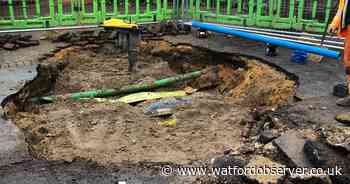 Watford road closed after 'void' opens up