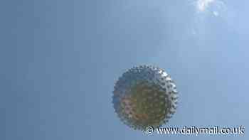 NASA astronaut spots 'two metallic spherical orbs' flying by his airplane over Texas