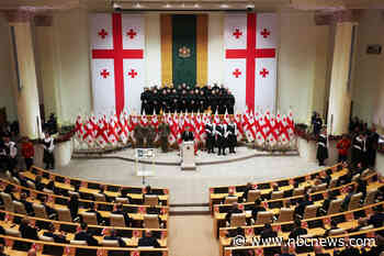New Georgian president sworn in; predecessor says he is not legitimate leader