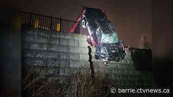 Pickup truck plunges off ledge and lands on roof after crashing through fence
