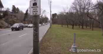 Toronto speed camera chopped down again and thrown into pond
