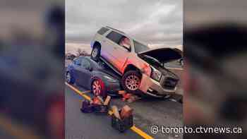 SUV lands on top of Tesla following collision on westbound QEW in Burlington