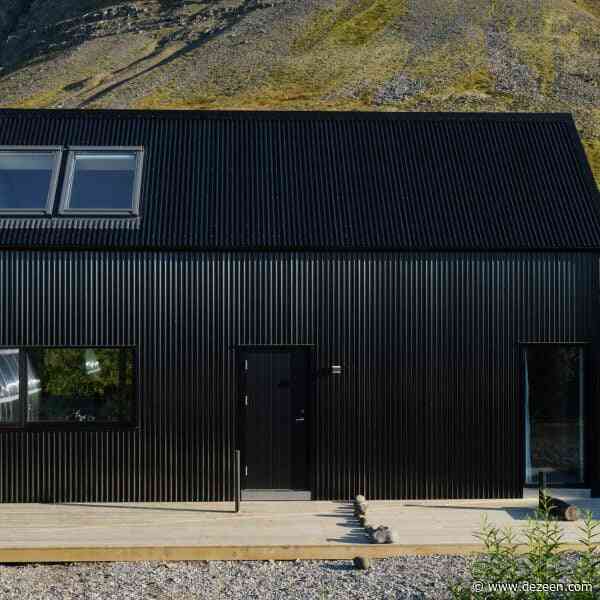 Studio Bua creates "elemental look" for black cabin overlooking Icelandic fjord