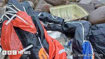 Volunteers clear 'hazardous' life raft from beach