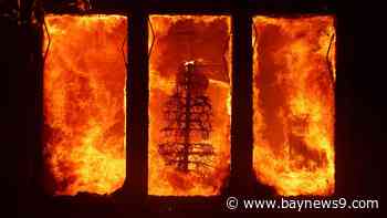 Wildfires burn out of control across Los Angeles area and kill 5 as thousands flee homes