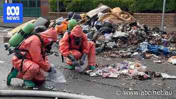 Garbage truck dumps load on Sydney street as toxic vapour cloud emits from rubbish
