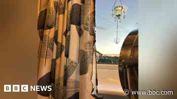 Magnifying glass reflecting sun starts fire