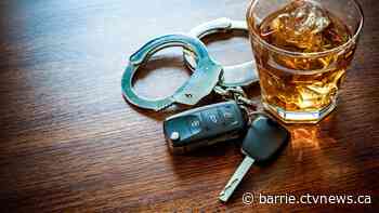 Parked car leads police to lay impaired charges