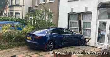 Woman who drunkenly crashed Tesla into Catford home wanted by police