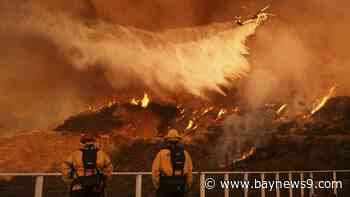 Firefighters race to contain Los Angeles wildfires with menacing winds forecast to return