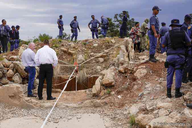 At least 100 illegal miners have died while trapped in a South African mine, group says