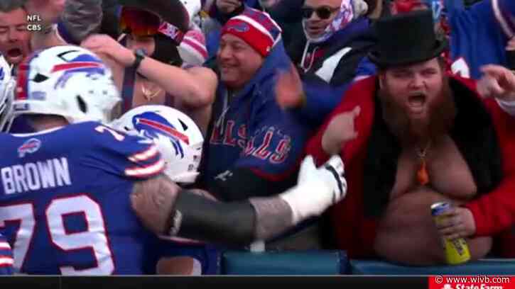 Viral Bills fan wears Nate Burleson's red jacket as good luck charm during playoffs