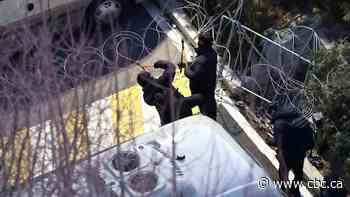 Police march on South Korean president's home with ladders and wire cutters in arrest operation