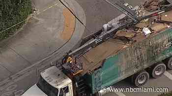 Trash truck crashes into power poles in NE Miami-Dade