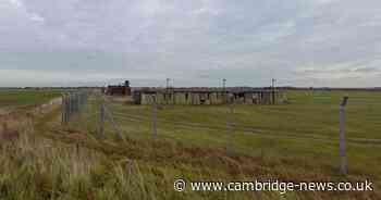 Former RAF base near Cambridgeshire border with abandoned buildings now used as racetrack