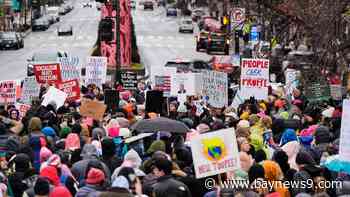 Thousands converge on Washington for a march days before Trump takes office