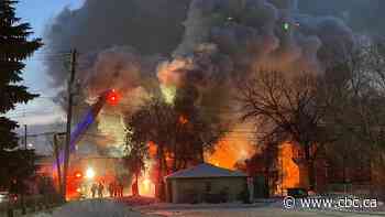 Winnipeg firefighters attack flames of burning North Point Douglas house on Sunday morning
