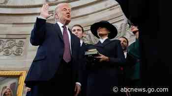Without putting hand on Bible, Trump takes oath of office