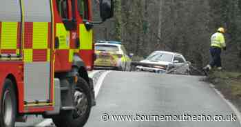 Road blocked both ways after car strikes telegraph pole