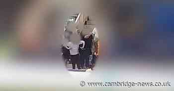 Teenager caught making racist gesture towards black football player