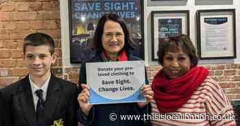 MP presents £100 voucher to generous donor at charity shop opening