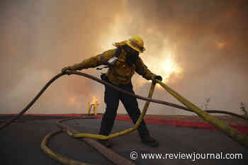 Aerial attack helps firefighters maintain the upper hand on a huge fire north of LA
