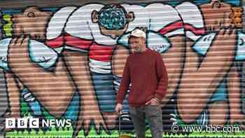 Artist restores mural daubed with graffiti tags