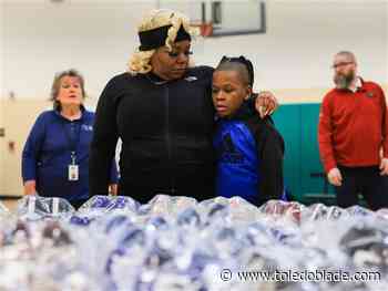 204 Toledo grade-schoolers get new shoes and socks at Yark Automotive giveaway